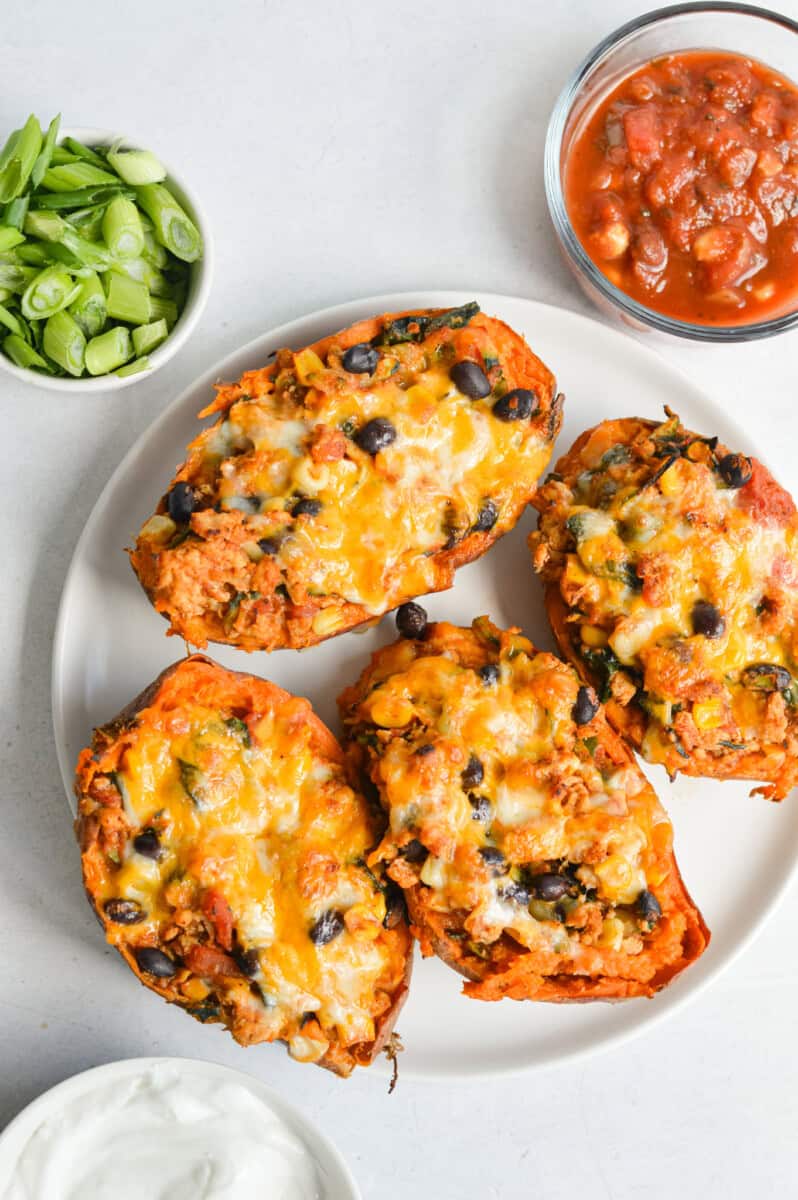Birds eye of a plate with 4 turkey stuffed sweet potatoes.
