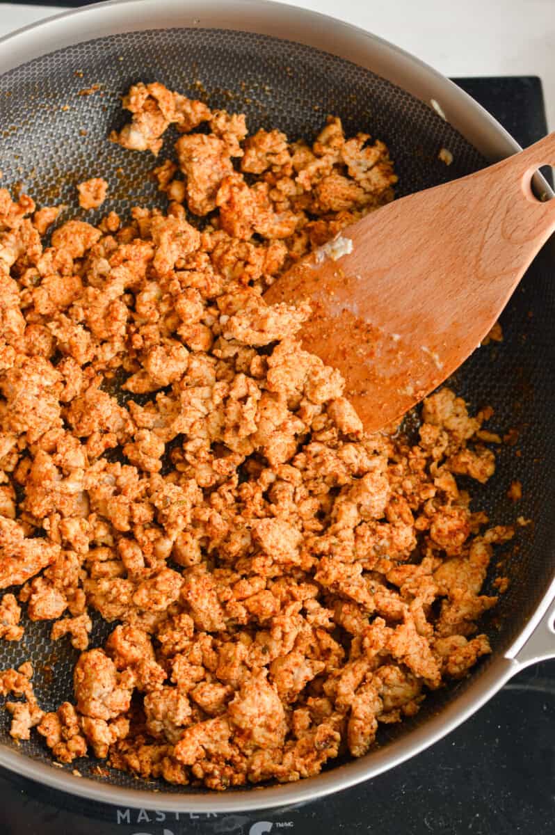 Cooking ground turkey in a pan.
