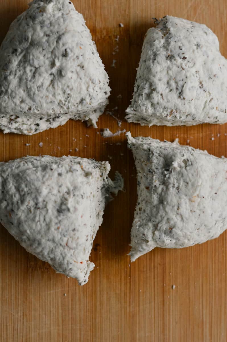 Cutting dough into individual portions.