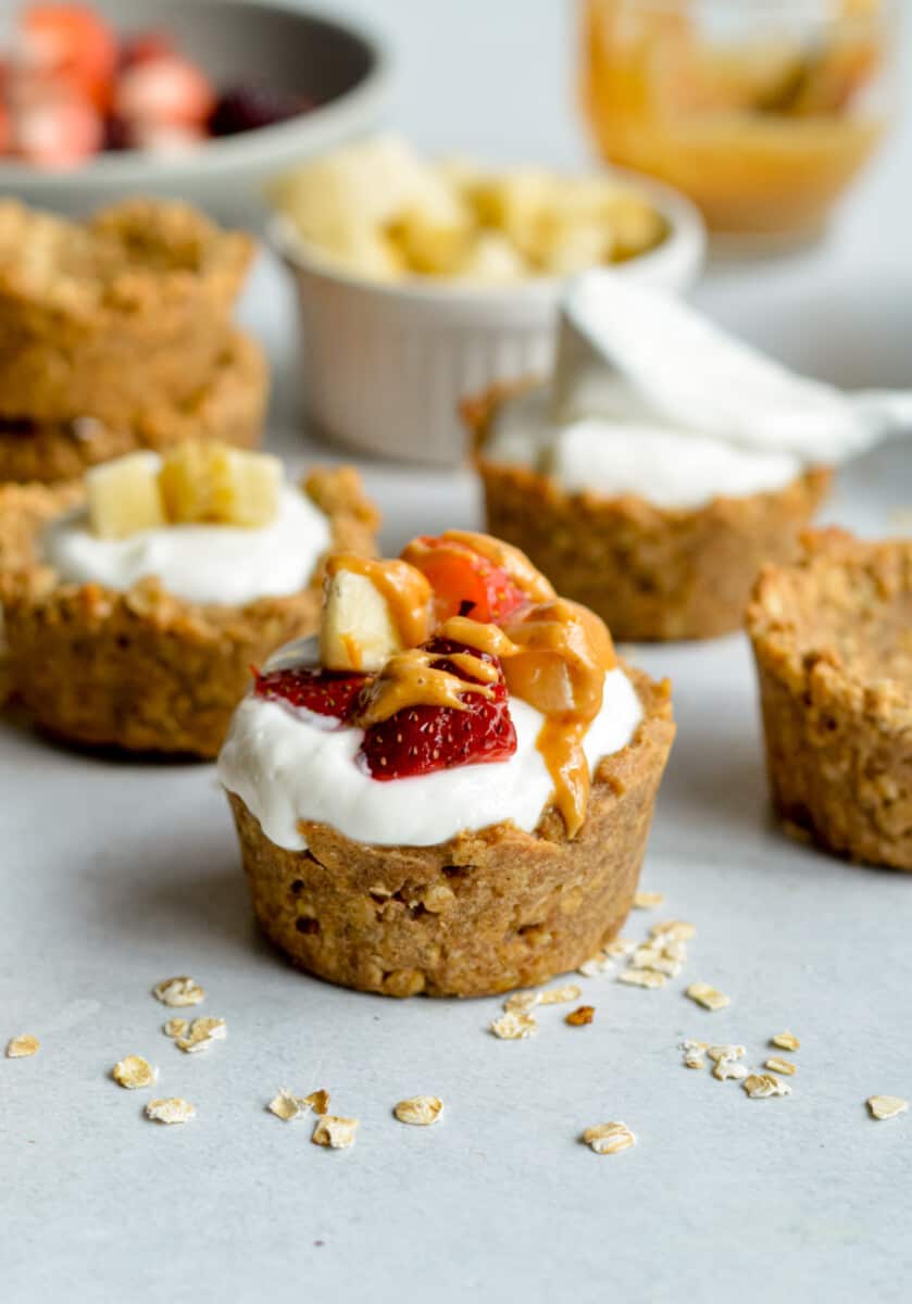 Granola cup filled with yogurt, fruit and peanut butter.