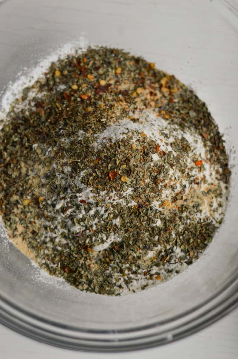 Mixing spices and baking powder with flour.