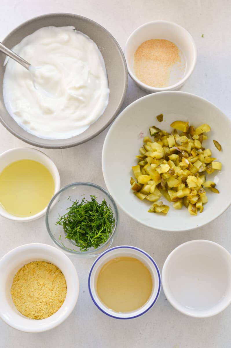 Ingredients including dill, pickles, Greek yogurt, spices, pickle brine, and white vinegar.