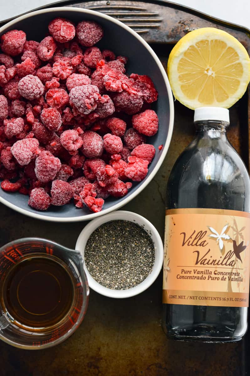 Ingredients including raspberries, lemon juice, chia seeds, maple syrup and vanilla extract.