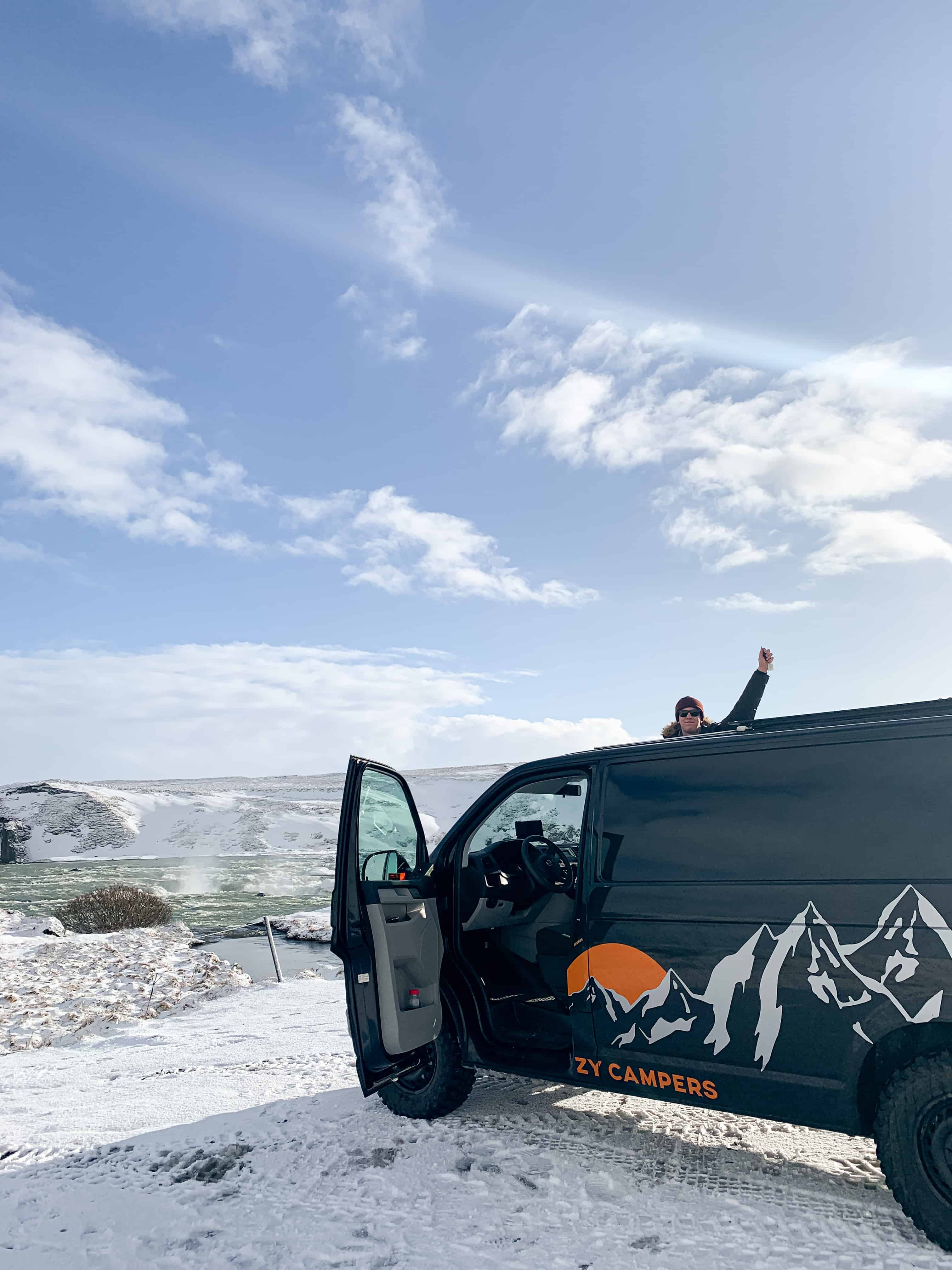 Brandon in front of our little van
