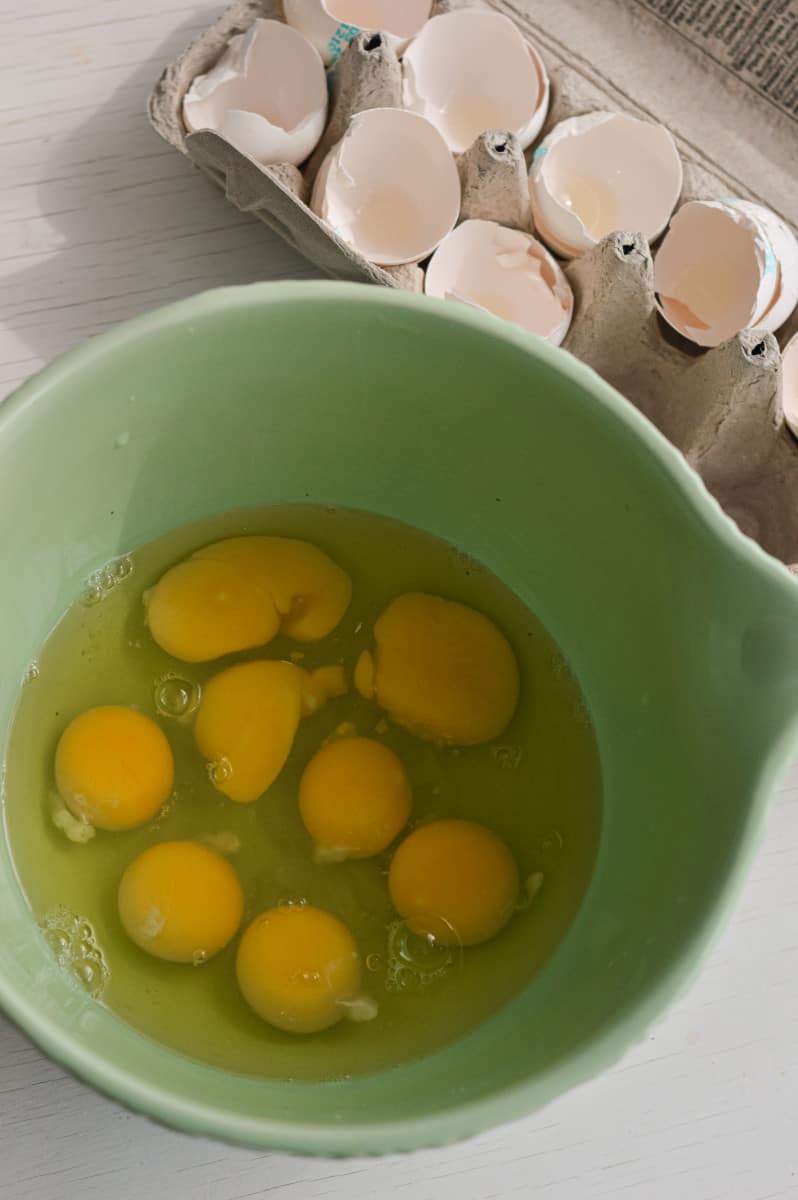 Cracking eggs in a bowl.