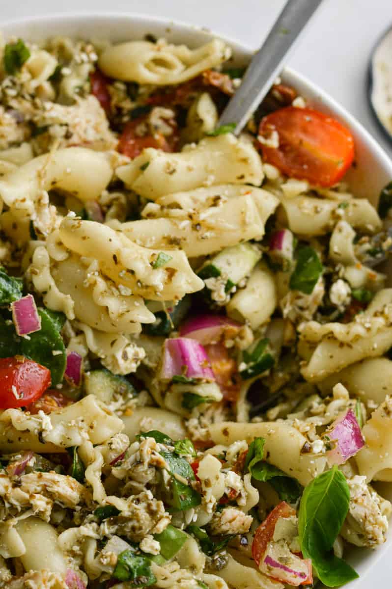 Close up of chicken pesto pasta salad.