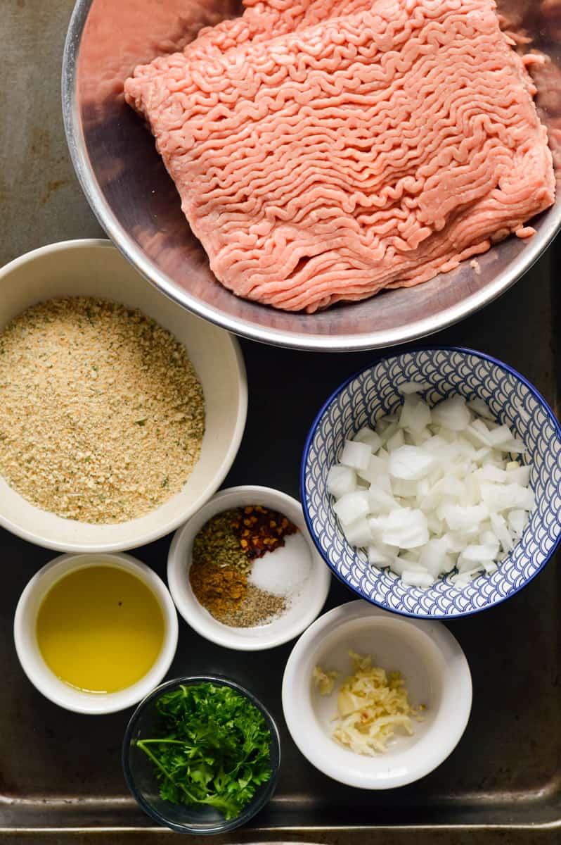 Ingredients including turkey, breadcrumbs, spices, feta and parsley.