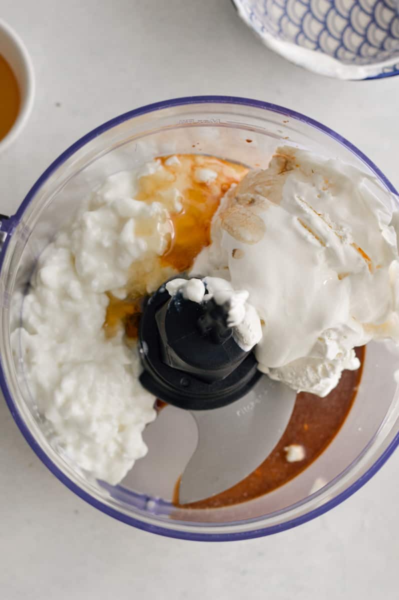 Adding ingredients to food processor.