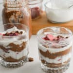 Two glasses of layered chia pudding parfaits.
