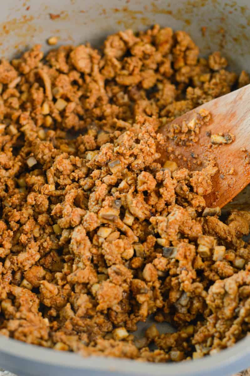 Cooking ground turkey in a pan.