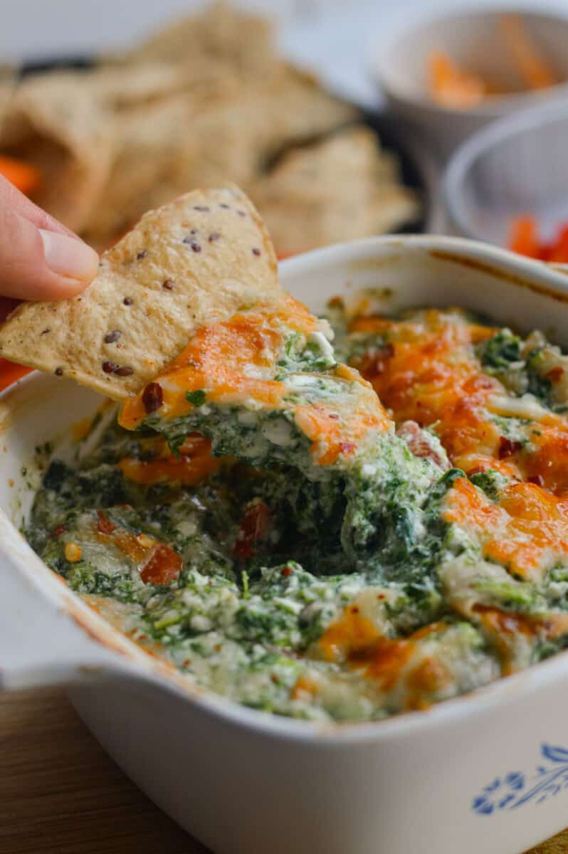 Dipping a chip in spinach cottage cheese dip.
