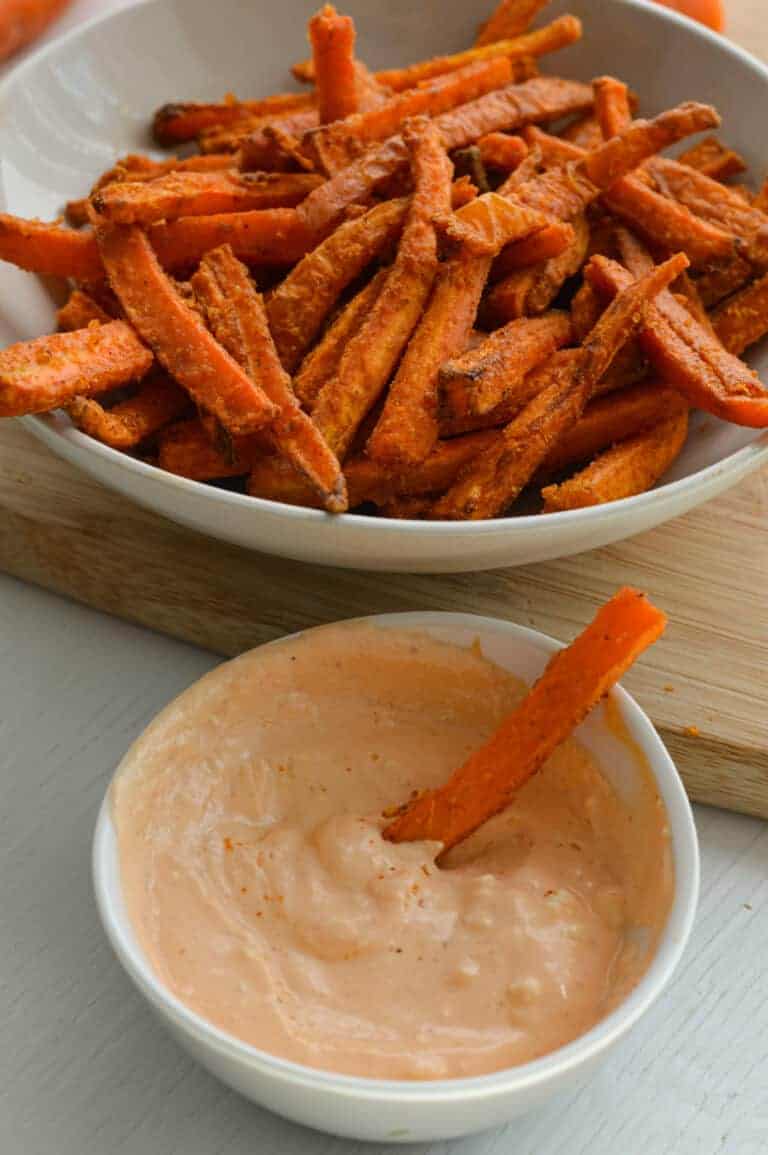 Dipping a carrot fry in sriracha mayo.
