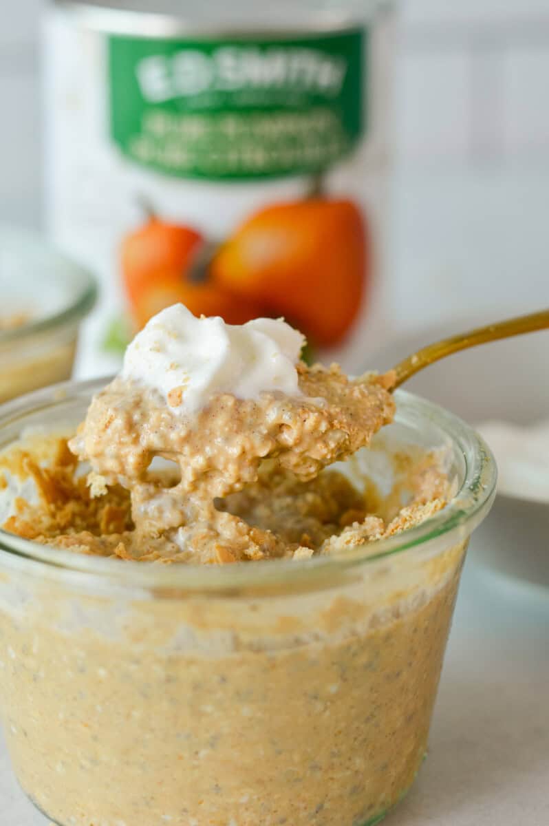 Scooping a bite of pumpkin pie overnight oats.