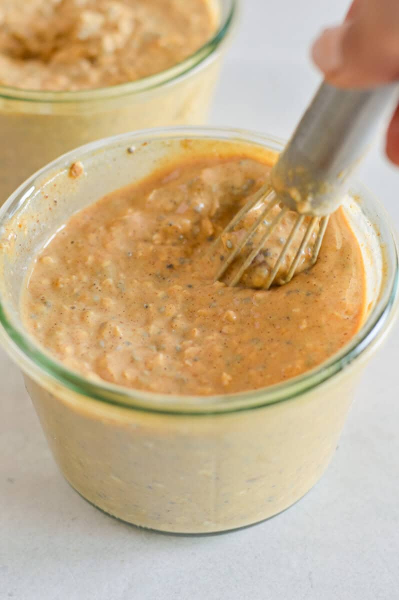 Mixing pumpkin overnight oats.