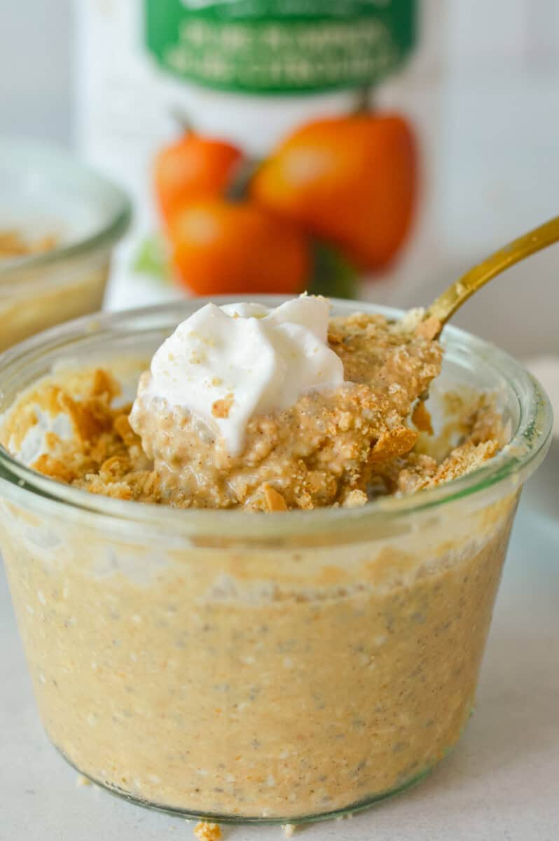Jar of pumpkin overnight oats topped with Greek yogurt.