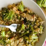 Broccoli Cauliflower Rice in a bowl with a fork.