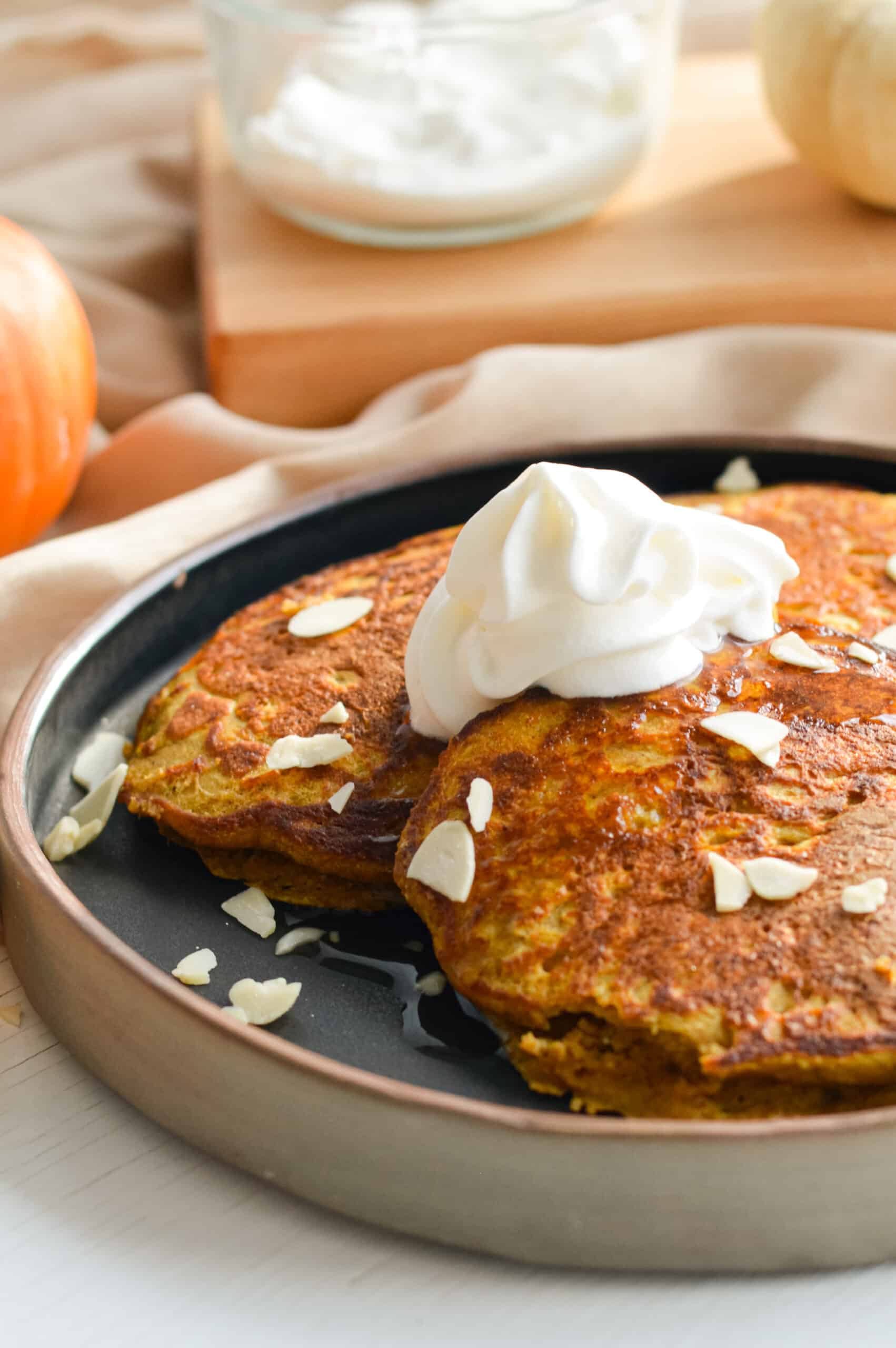Oatmeal pumpkin pancakes with toppings.