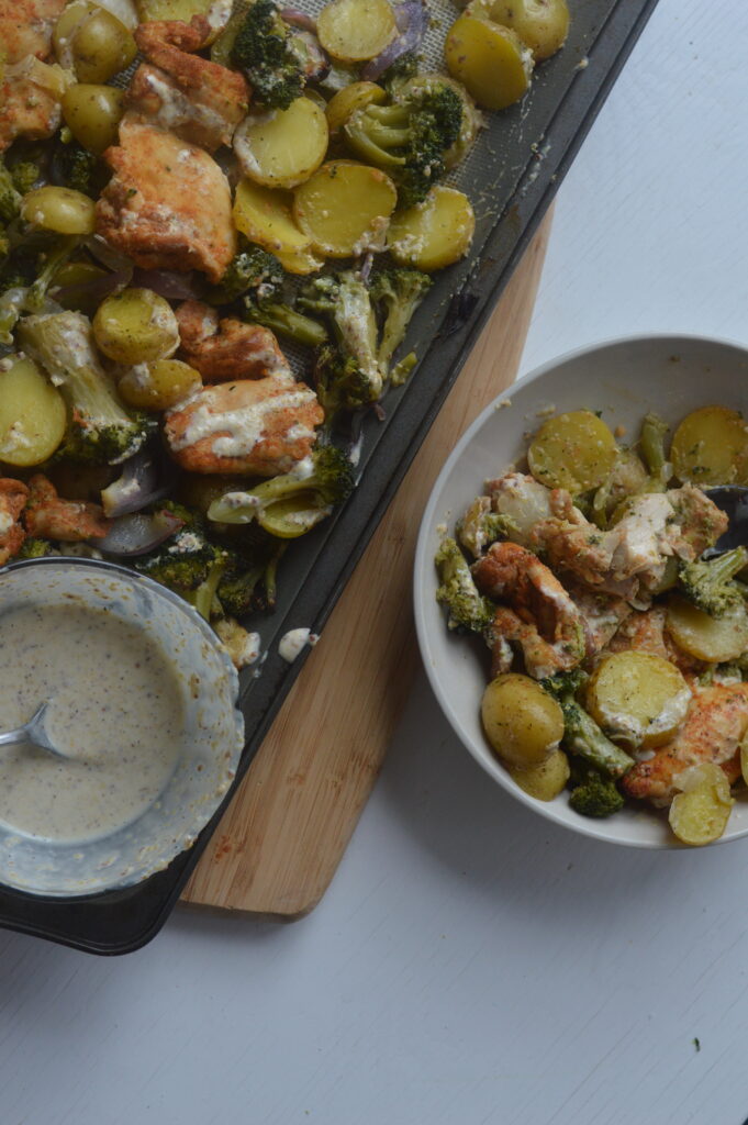 Sheet pan chicken broccoli potato with honey mustard sauce.