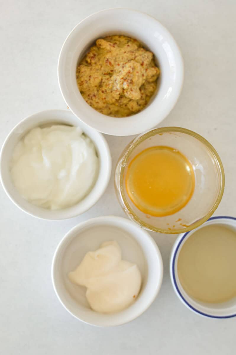 Ingredients including honey, dijon mustard, myonnaise, Greek yogurt and vinegar.