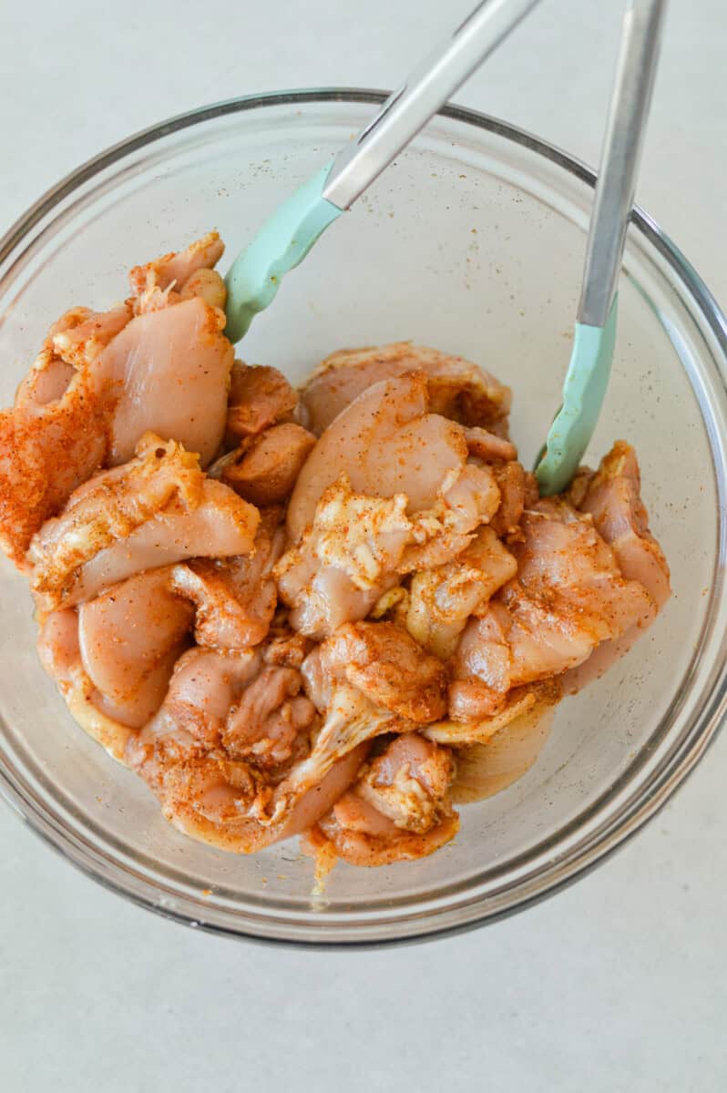 Marinating chicken thighs in cumin, paprika, garlic powder, onion powder, chipotle powder, brown sugar, salt and pepper.