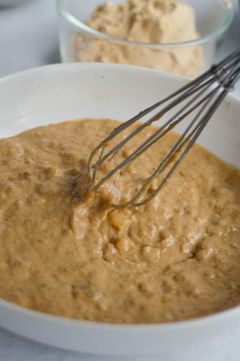 Mixing mashed banana, peanut butter, vanilla and a flax egg.
