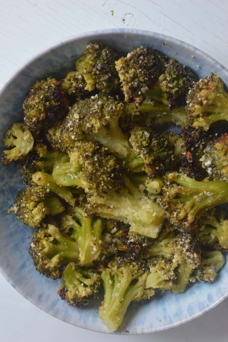 Air fryer frozen broccoli in a bowl.