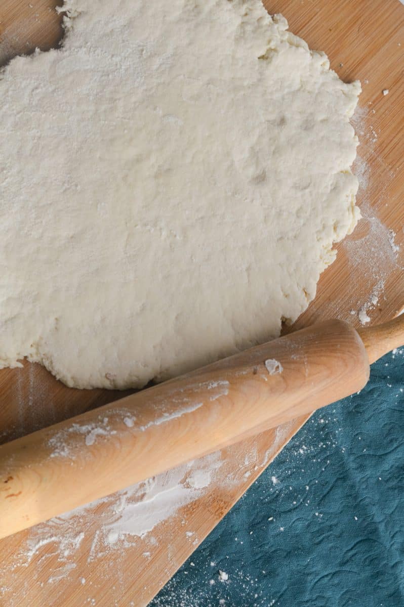 rolling out cinnamon roll dough