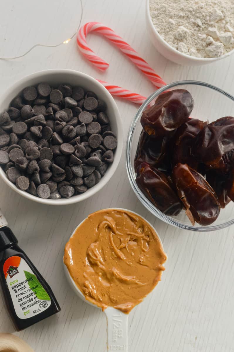 Date truffles ingredients, including peanut butter, dates, peppermint, and chocolate chips.