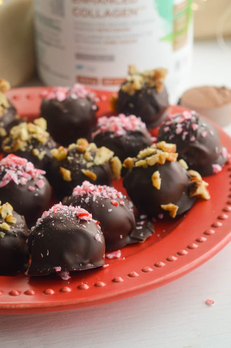 Close up of no bake chocolate truffles with walnuts and candy cane.