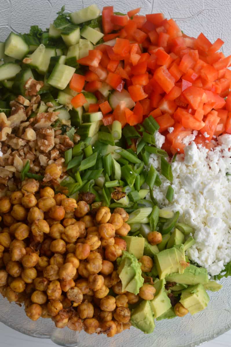 Combining ingredients for salad in a bowl.
