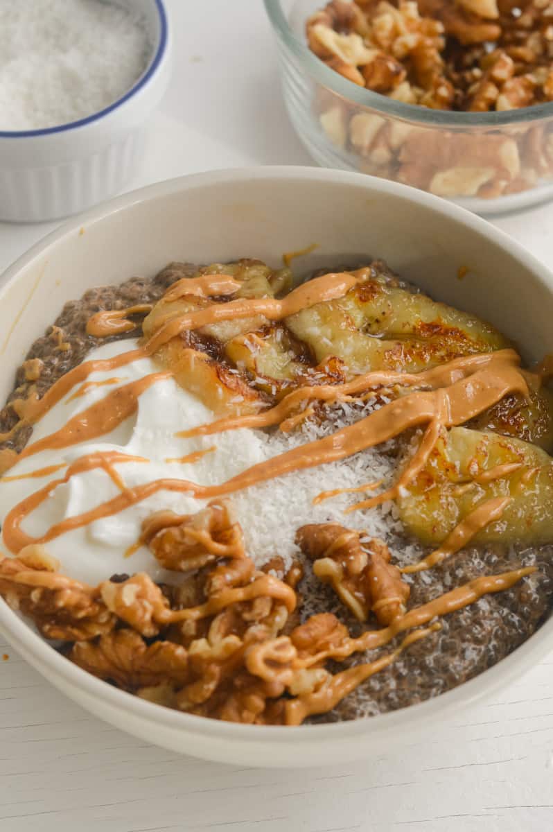 Warm chia pudding topped with peanut butter, yogurt, caramelized banana,s and walnuts.