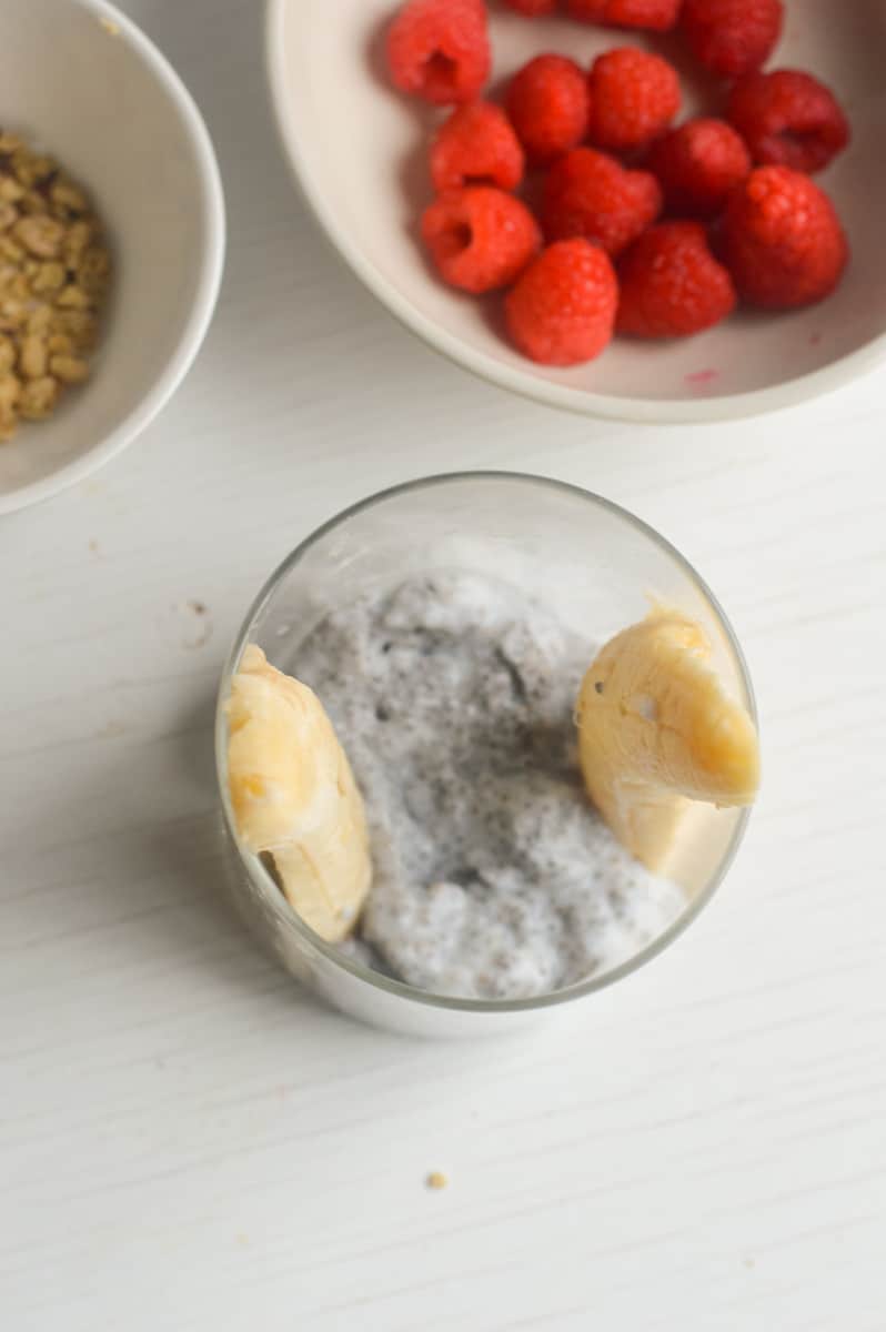 Adding yogurt to jar.