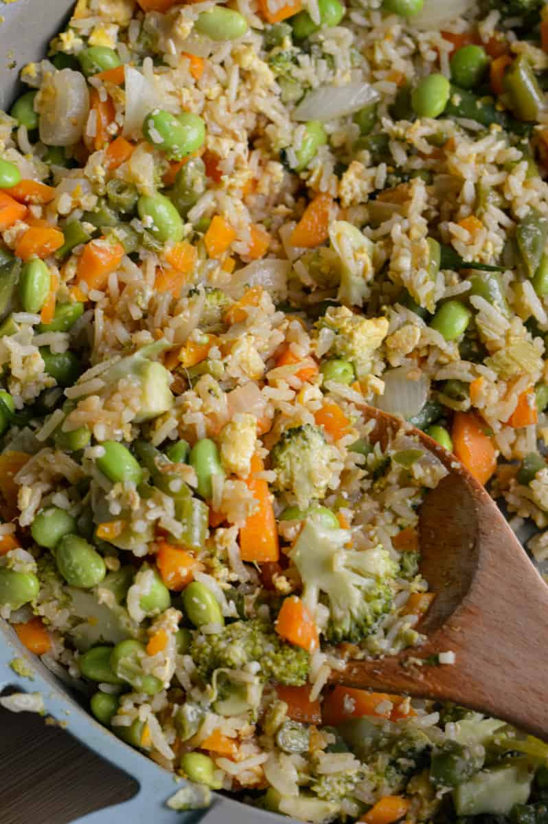 Cooking vegetarian fried rice in a pan.
