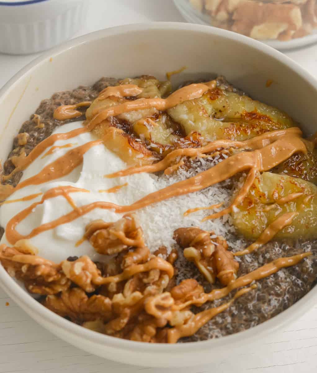 Warm chia pudding topped with peanut butter, yogurt, caramelized banana,s and walnuts.
