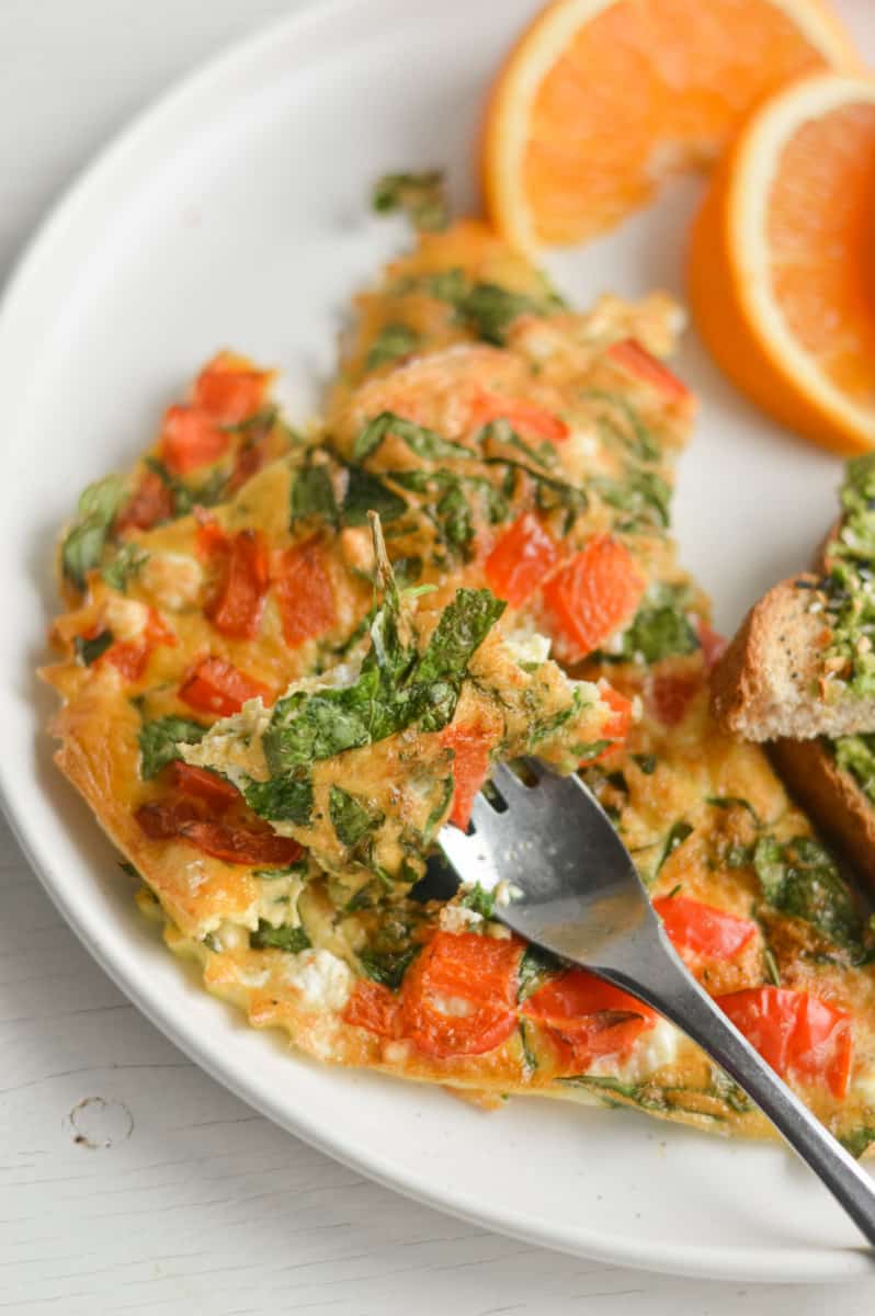 Bite of omelette on a fork.