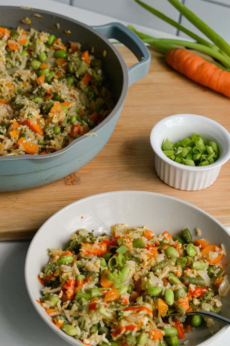 Serving vegetarian fried rice in a bowl.