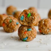 Two 3-ingredient peanut butter oatmeal balls stacked on top of each other.