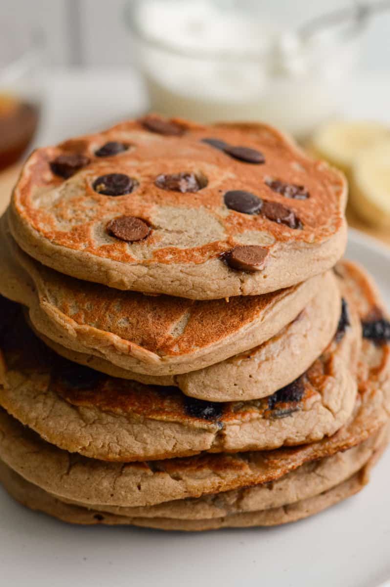 Stack of 3 ingredient protein powder pancakes with chocolate chips.