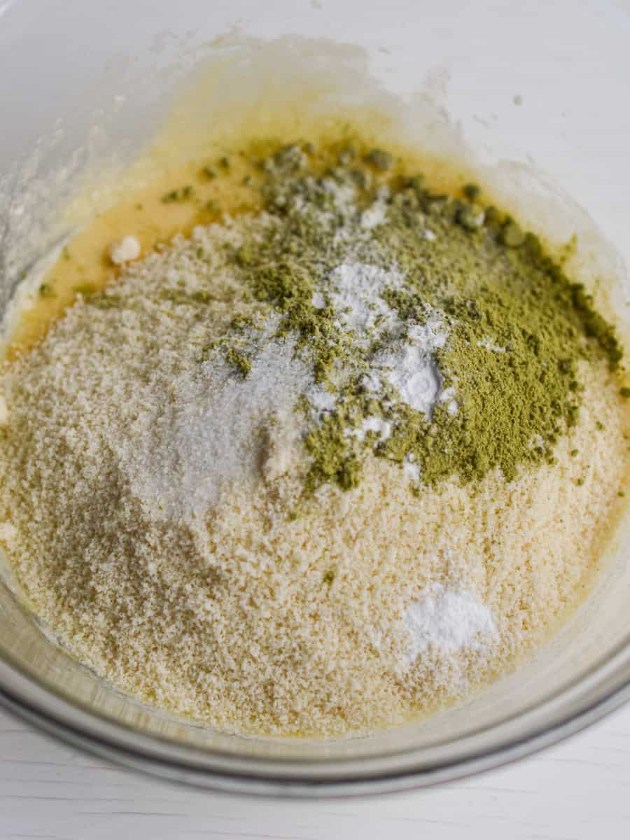 Adding dry ingredients to butter and sugar.