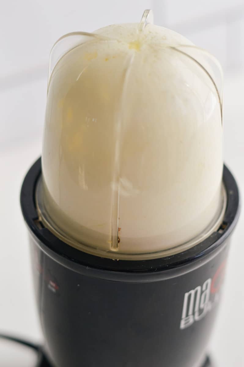 Making whipped feta dressing in a blender.
