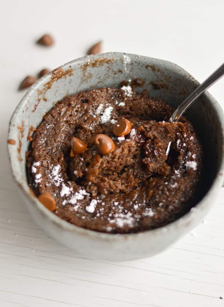Microwave protein mug cake topped with chocolate chips.