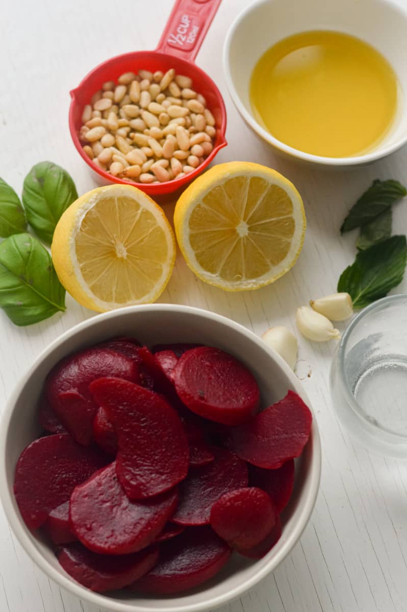 Ingredients for pink pasta sauce including beets, parmesan and pine nuts.