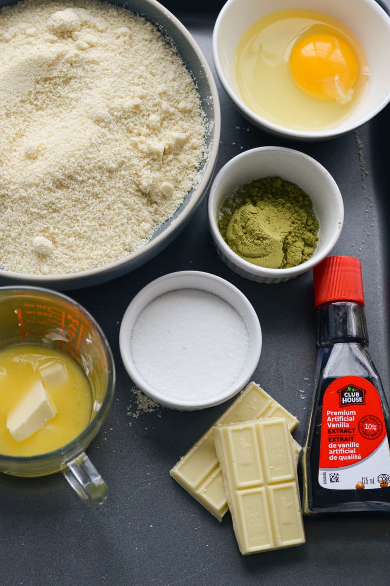 Ingredients for matcha cookies on a tray.