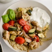 Pesto chicken quinoa bowls with whipped feta dressing.