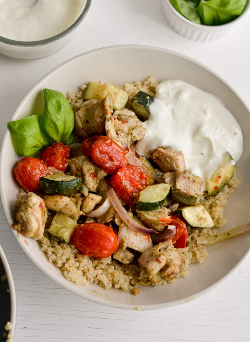 Pesto chicken quinoa bowls with whipped feta dressing.