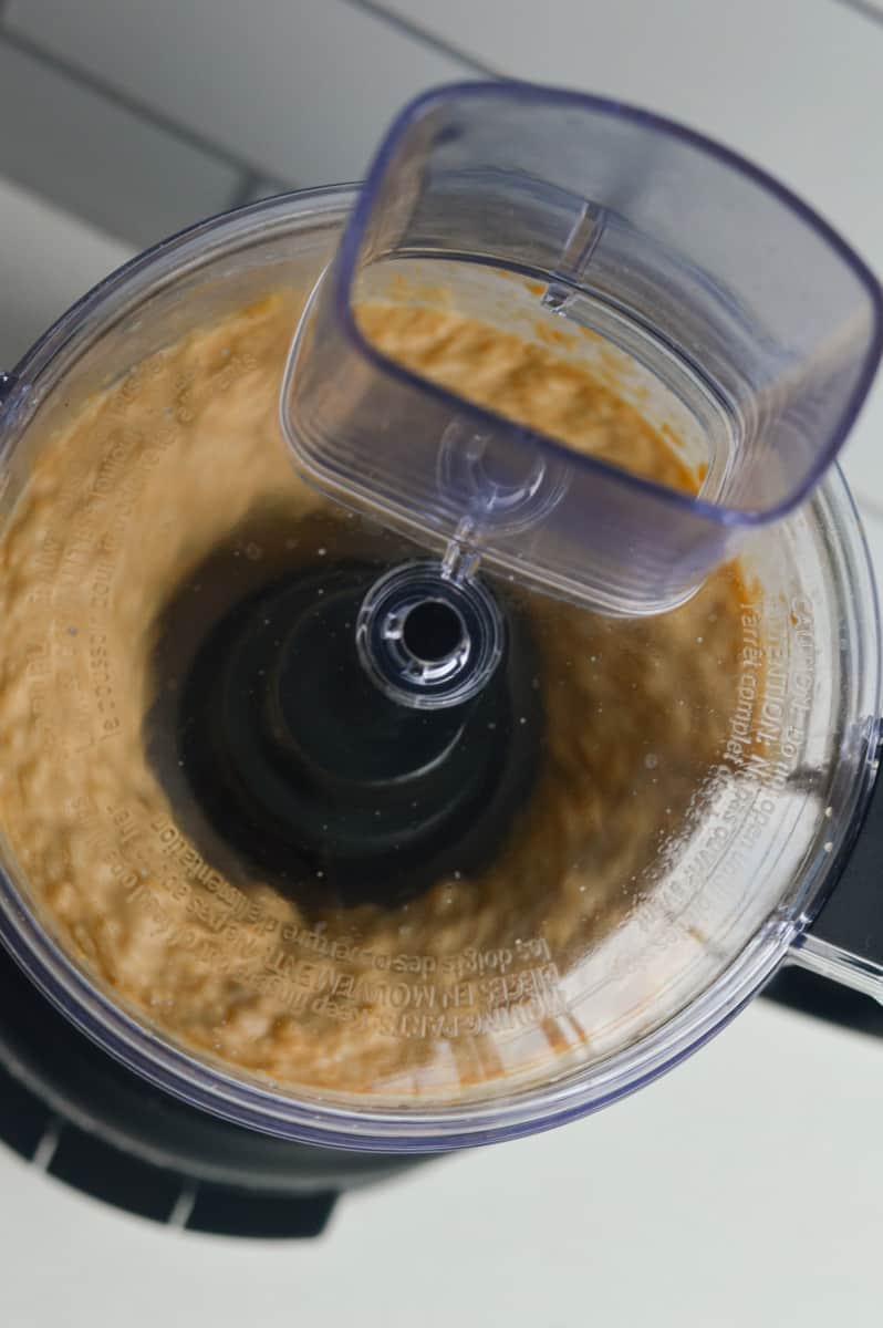 Pulsing ingredients in a food processor.