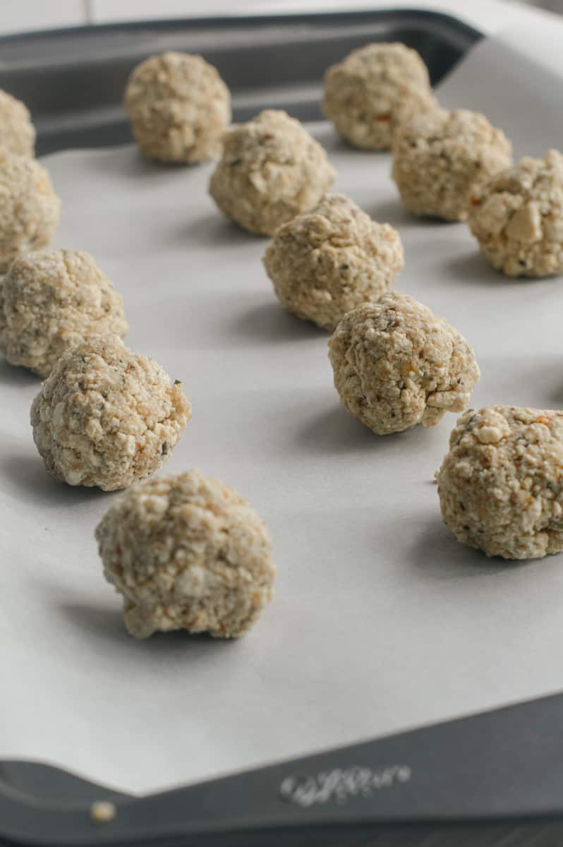Rolling out tofu meatballs.