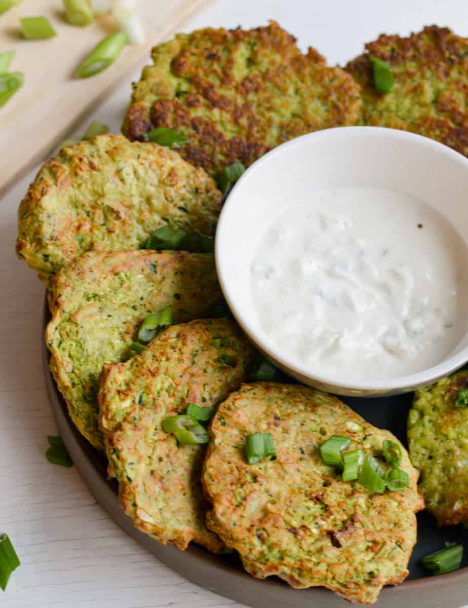 Zucchini and edamame fritters served with dip.