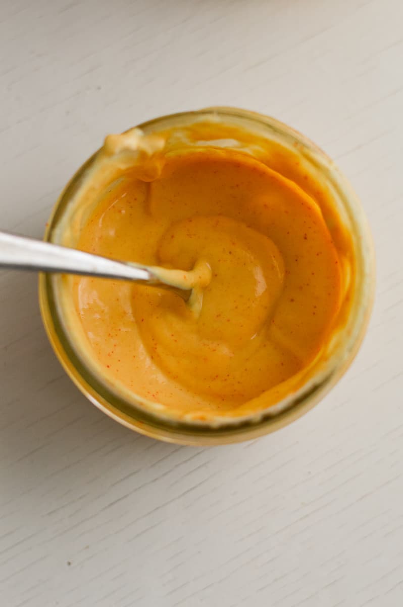 Mixing sauce in a jar.