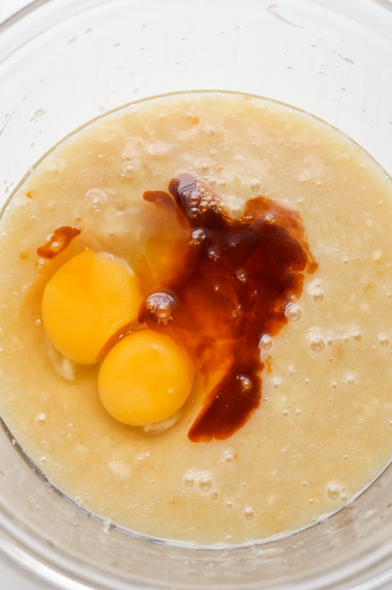 Beating eggs into batter.